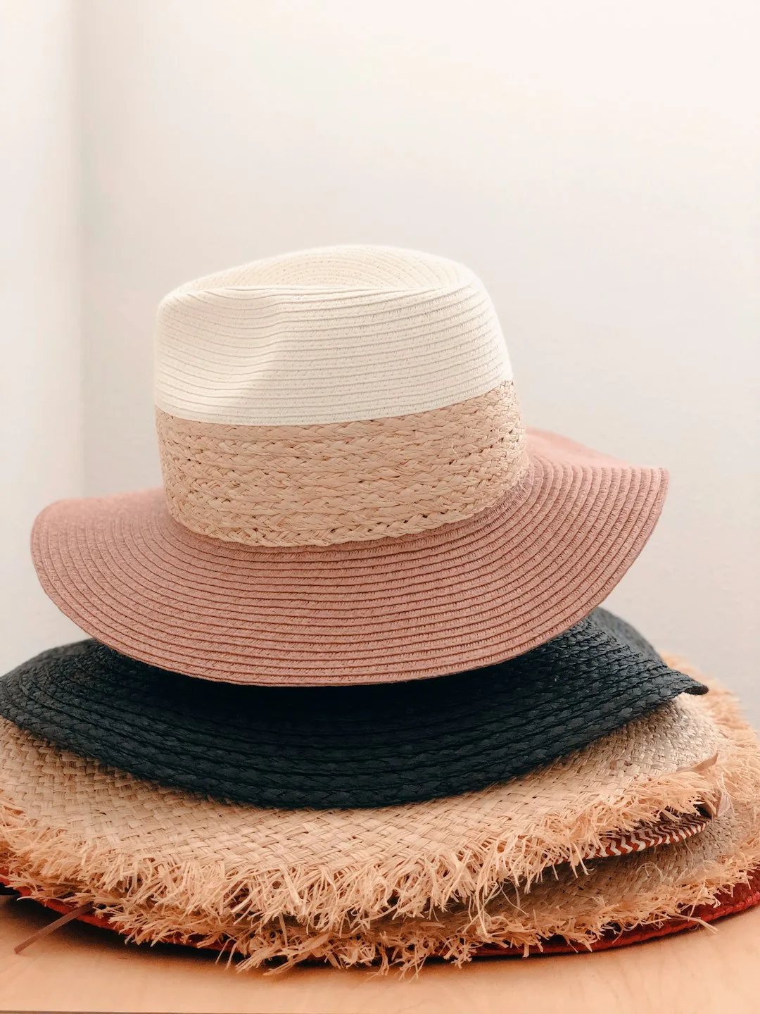 Wide-brim straw sun hat with a navy ribbon band